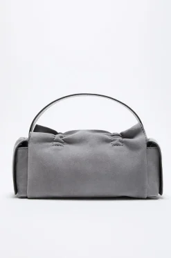 Multipocket suede shoulder bag